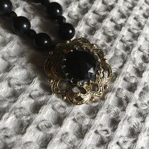 Black 15-in. beaded necklace with antique pendant